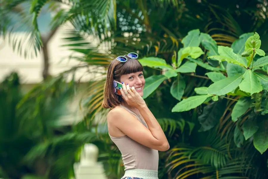 Traveller smiling with her phone